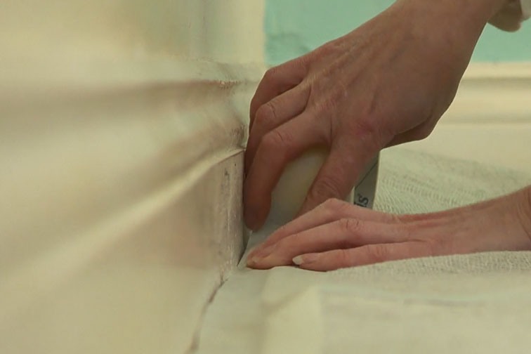 Use masking tape to keep the dust sheet in place.